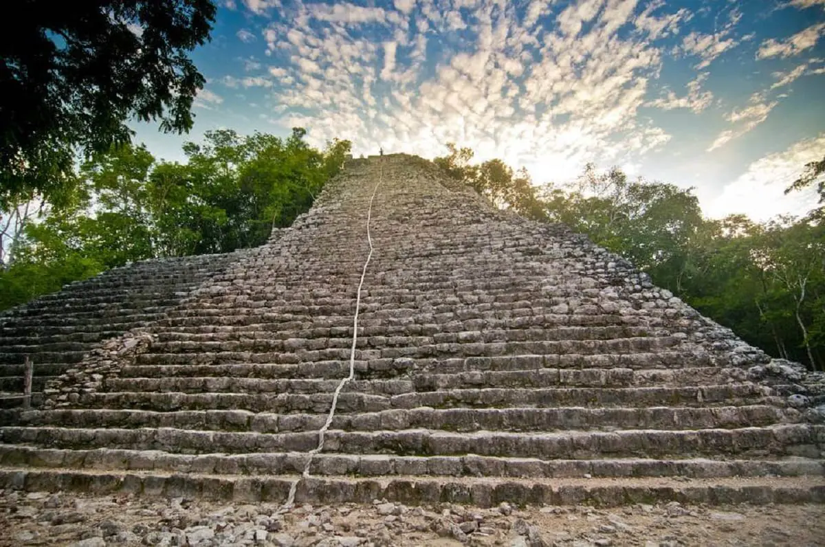 People climbing up the nohoch mul maya ruin at coba