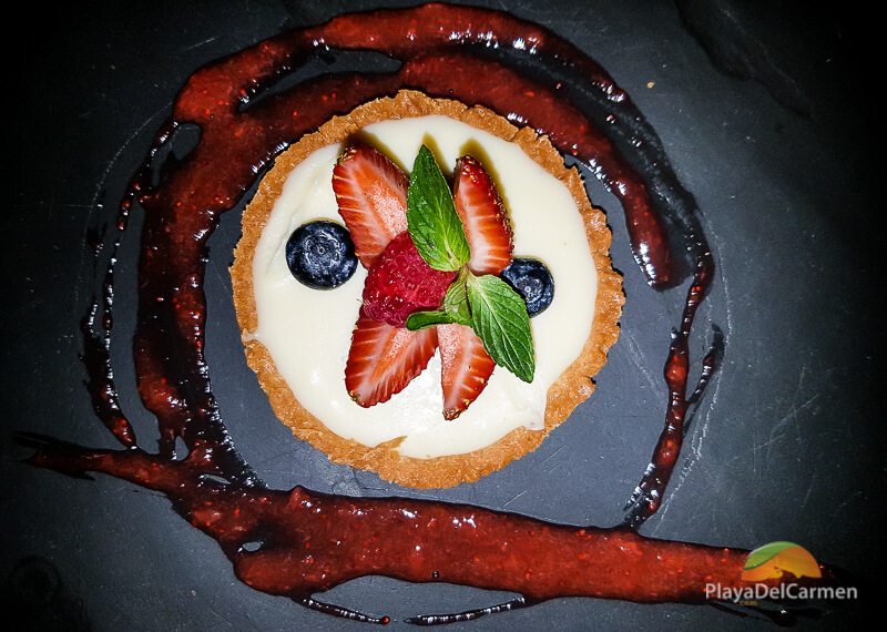 White chocolate tartlet with raspberries and strawberries at Patanegra restaurant in Playa del carmen 