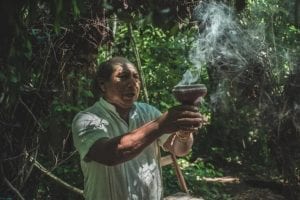 Person at mayan ceremony of balche in Punta Laguna, Tulum, México