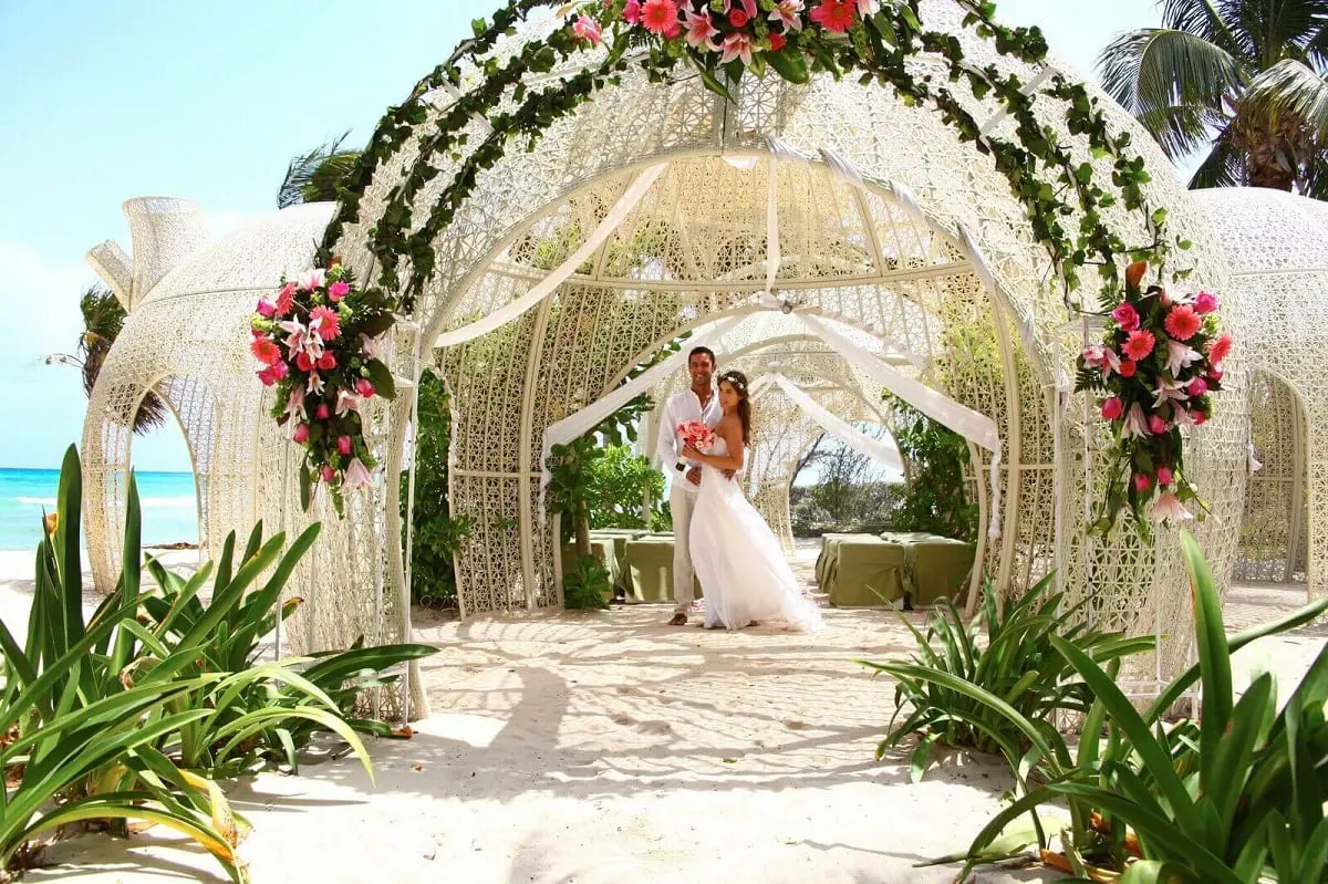 Beautiful wedding on beach with pink flowers