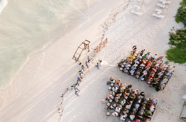 an aerial image of a beach wedding 