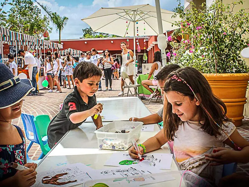 Kids play at the Mayakoba Farmer's Market in El Pueblito