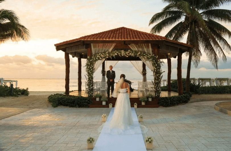 bride approaching a wedding gazebo in Playa Del Carmen