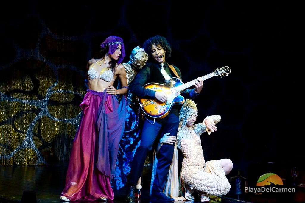 A musician sings with dancers at Rauxa Tulum