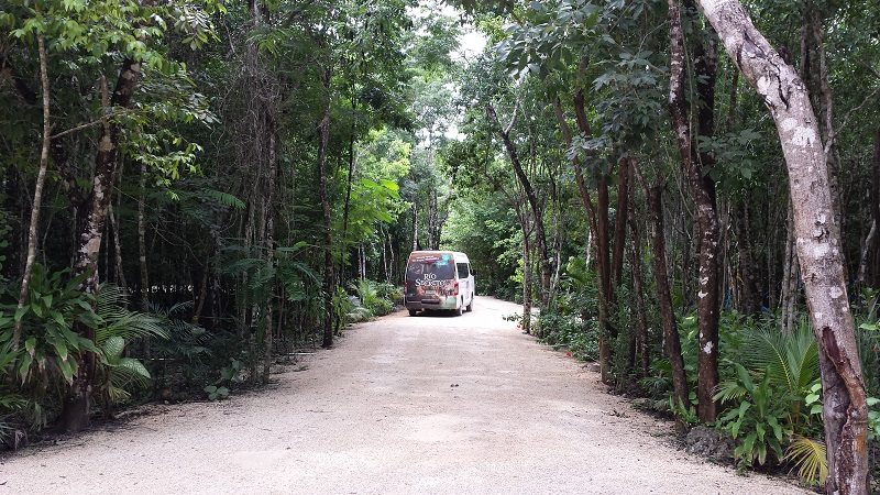 vehicle driving away at rio secreto