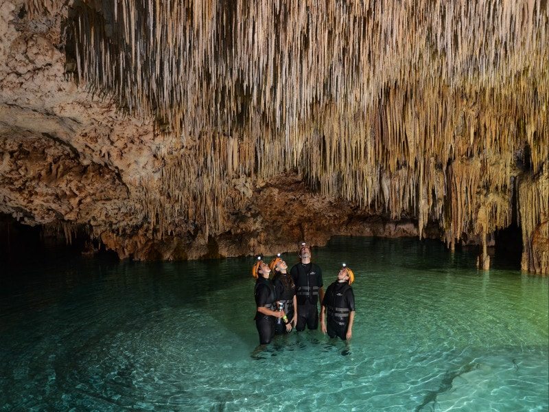 People looking up while in rio secreto