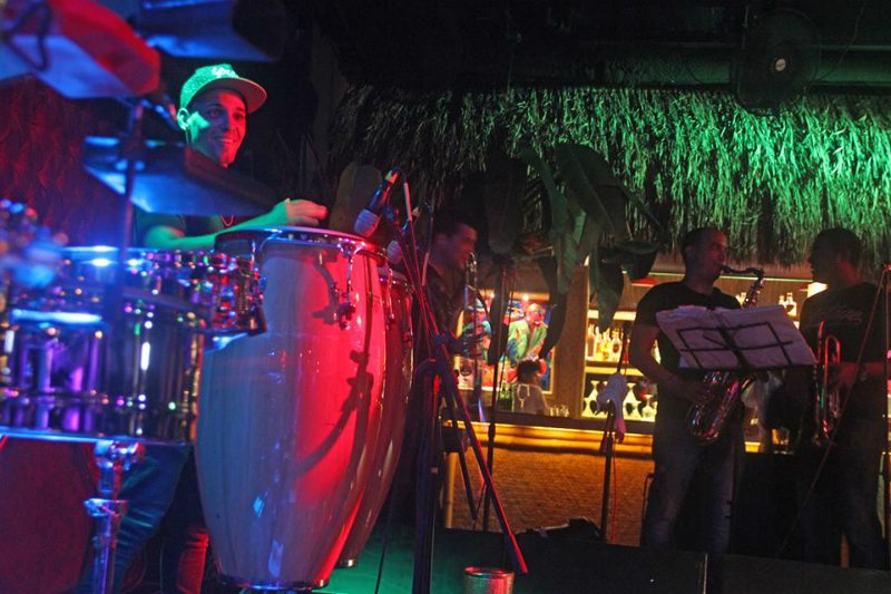 People performing latin music at Salón Salsanera, located in Cancun