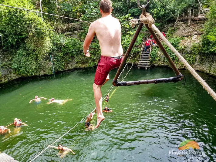 Guy jumping in underground cenote