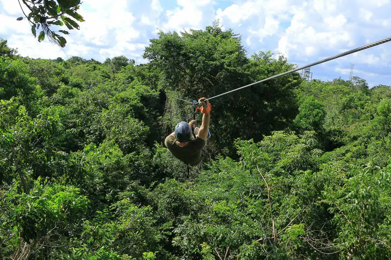 Guy zip lining at selvatica, cancun