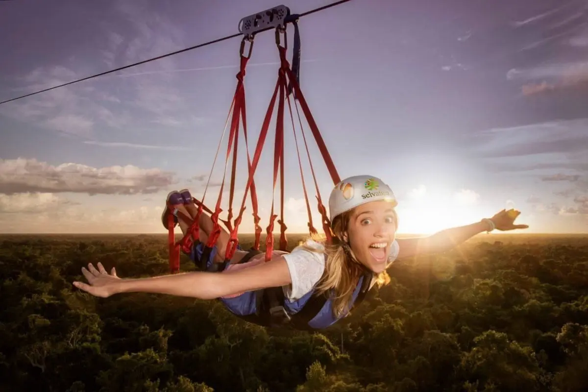 Woman on Tarzania zip line at Selvatica Park Cancun