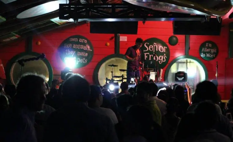 person preparing the mic for live music at Señor Frogs in Playa del Carmen