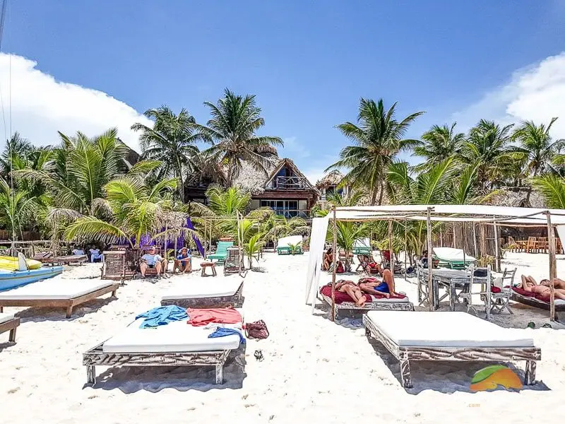 Tulum beach club with tanning chairs