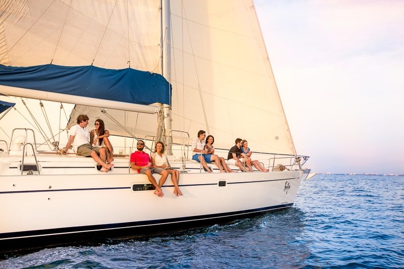 Couples enjoy the sunset over the Riviera Maya aboard a luxury catamaran