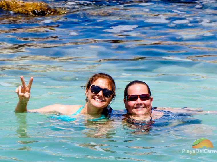 PlayaDelCarmen.com colleagues greet the camera in Puerto Aventuras