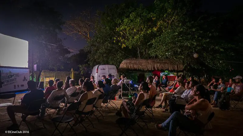 People watching a movie outside