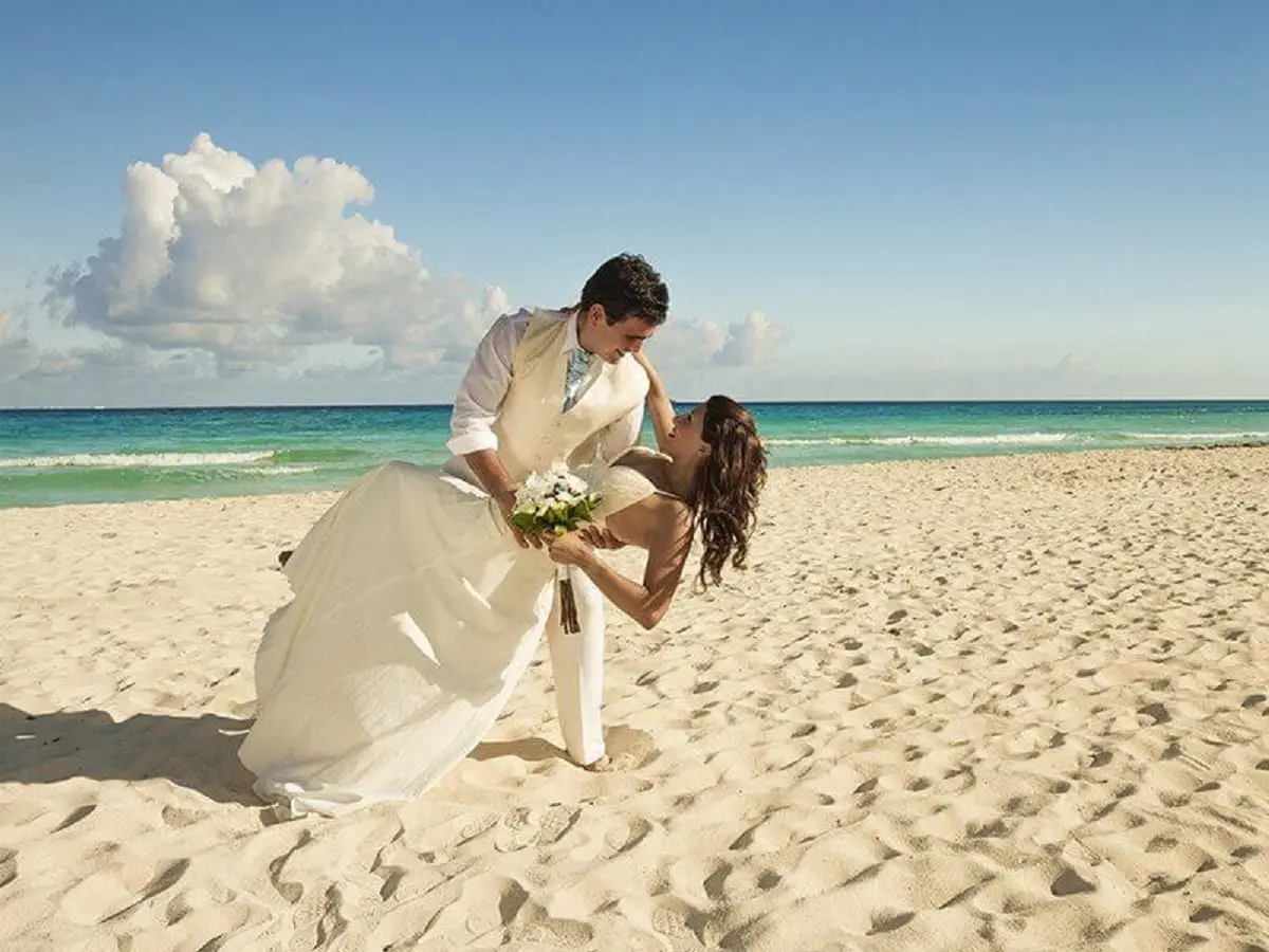 Couple on beach for their wedding