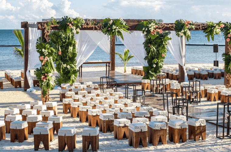 wedding setup for a large beach wedding at Breathless Riviera Cancun 