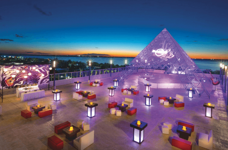 wedding setup at Hard Rock Cancun with a pyramid and casual seating areas 