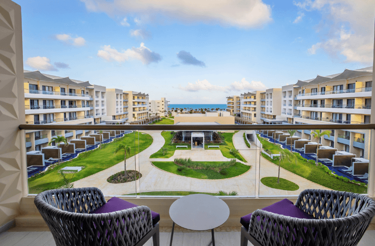 balcony at Planet Hollywood Cancun with views across a landscaped area towards the Caribbean Sea 