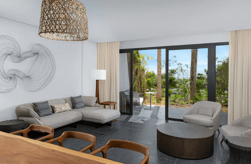 seating area in tropical view suite at Conrad Tulum Riviera Maya 