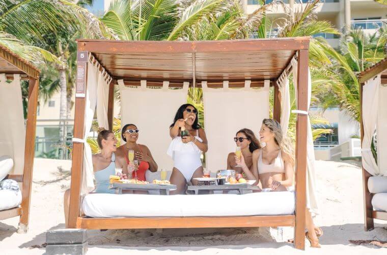 The beach cabanas are the perfect place to hang out with your bridal party 