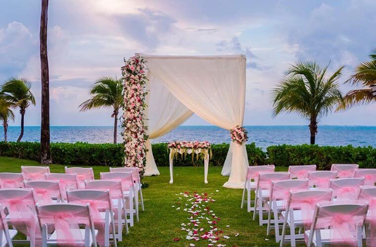 wedding arch and chair set up in the garden at Riu Palace Peninsula