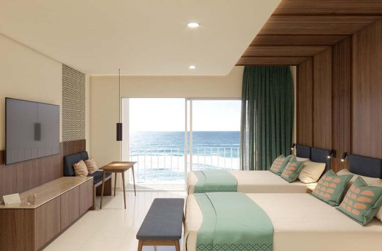a room with two beds at Royal Uno Cancun 