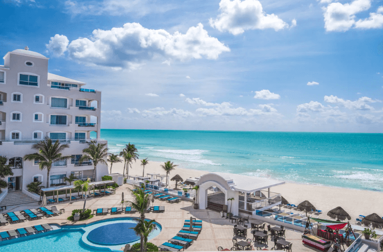 view across the pool and Caribbean Sea at Wyndham Alltra Cancun