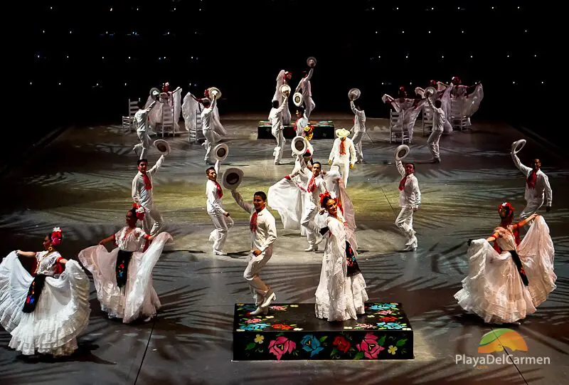 People performing in white clothes at Spectacular Mexico at Xcaret