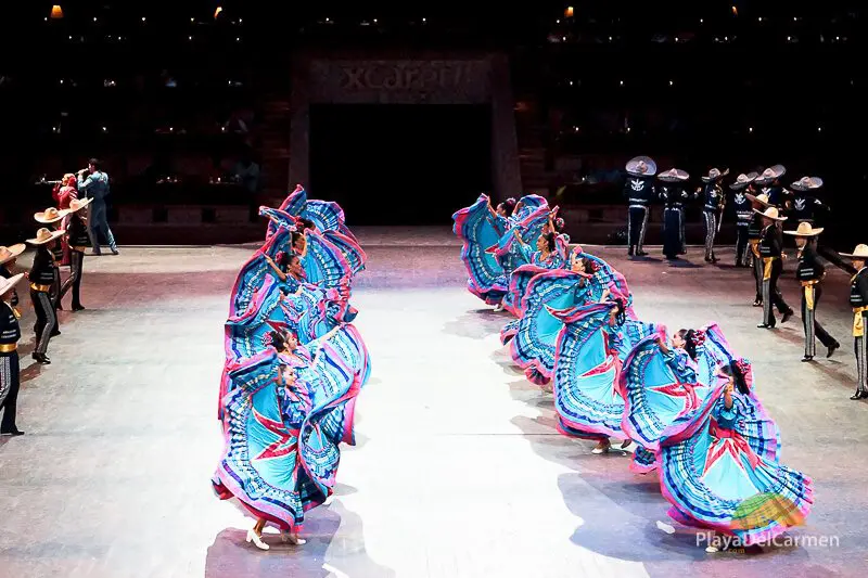Dancers in colorful dresses performing at Spectacular Mexico at Xcaret