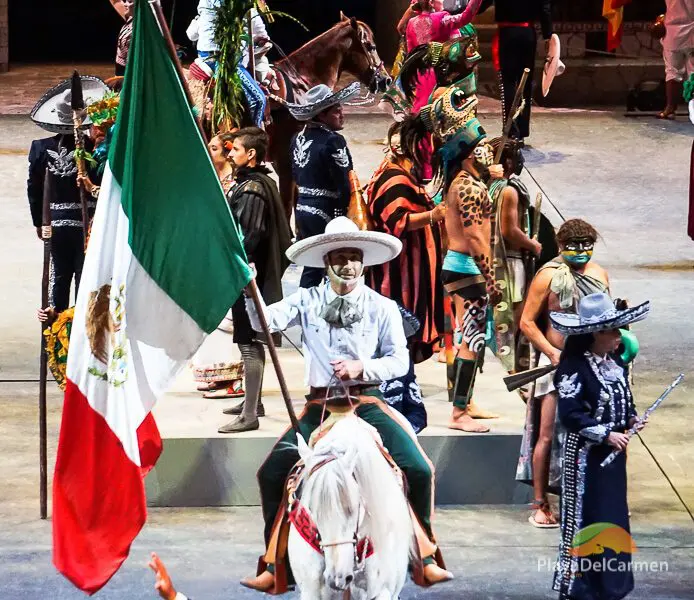 Person on horse with the mexican flag on stage at Spectacular Mexico at Xcaret